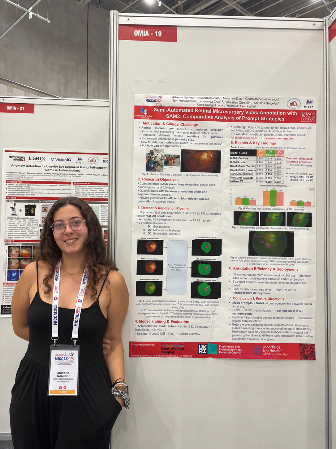 Adriana Namour beside her first-author research poster at OMIA, MICCAI 2025